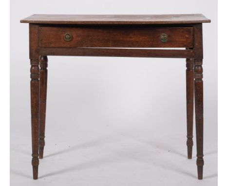 A George IV mahogany bow-fronted side table; with an overhanging top, fitted with a single long drawer, on ring turned tapere