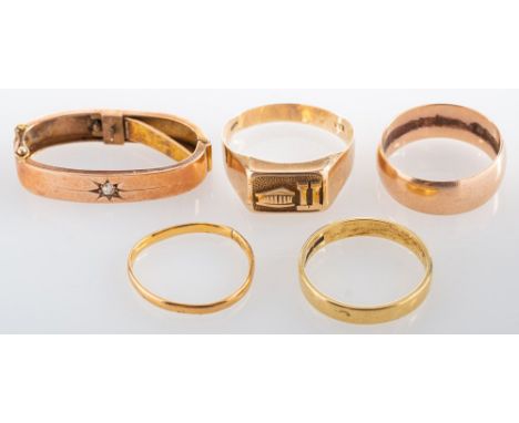 An 18ct gold ring, the polished band, stamped 18 with full London hallmarks for 1973, ring size P; three further rings; and a