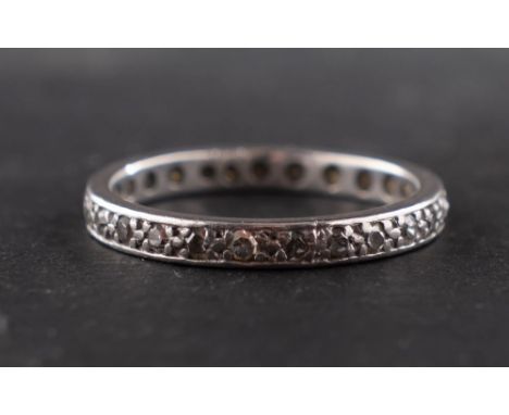 A single-cut diamond eternity ring, total estimated diamond weight ca. 0.25ct, ring size K, total weight ca. 2.7gms.





