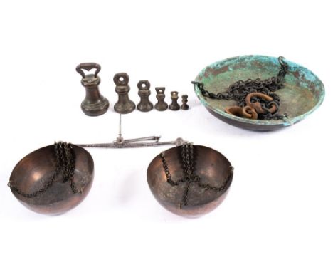  A set of Georgian steel balance scales with copper pans, together with a set of Victorian Brass  graduated bell weights and 