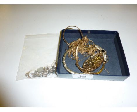 A tray containing gold plated necklaces, a bangle, a 9ct gold ring, white metal ear-rings, a dress ring etc.