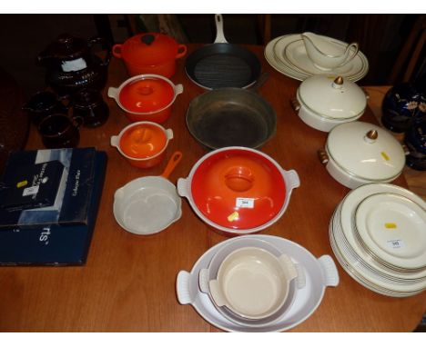 A set of eight pieces of Le Creuset enamel and cast iron cookware; a large cast iron frying pan etc. 