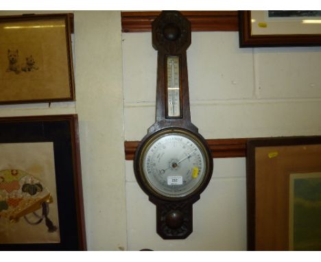 An oak cased aneroid barometer 