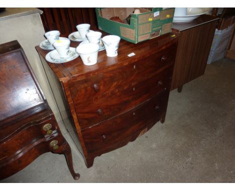 A Victorian mahogany commode in the form of a bow front chest 