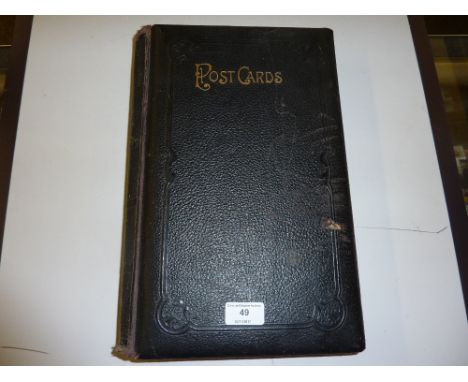 A large leather bound post-card album and contents 