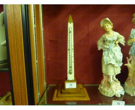 An olive wood thermometer