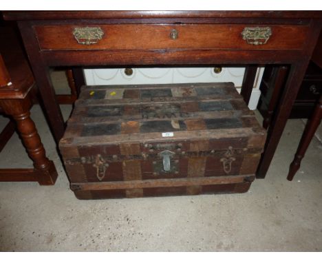 A metal and wooden bound trunk 