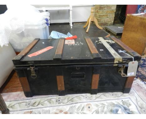 A metal and wood bound travelling trunk. H.33cm W.83cm D.46cm