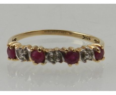 A 10 carat yellow gold, ruby and diamond half eternity ring. 