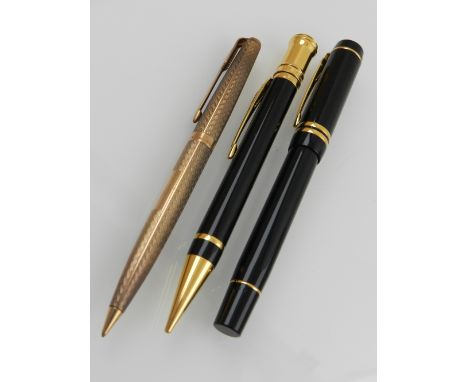 A Parker 9ct propelling pencil, with an engine turned body and vacant cartouche, together with a Parker Duofold fountain pen 
