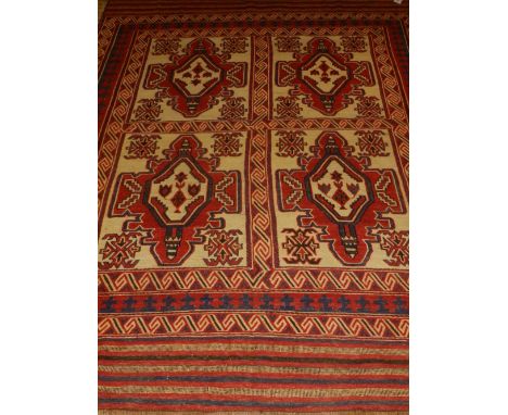 A cream ground Safhari carpet, decorated with geometric patterns to centre, within many borders, fringed. L.285cm W.212cm