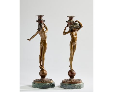 Edward McCartan (1879-1947) Pair of figural candlesticks, 20th century  Bronze, marble bases  45cm high (2)    Condition Repo