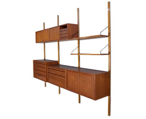 Poul Cadovius (1911-2011)   'Royal System' wall system, comprising four uprights ; one four drawer unit ; one three drawer un