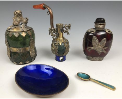 A Chinese red glass and silver coloured metal mounted snuff bottle, 9 cm high, a hardstone caddy, and a pipe 