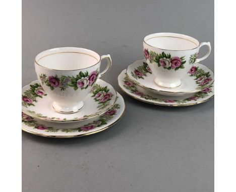 COLCLOUGH PART TEA SERVICE, with floral and gilt decoration, comprising seven cups, nine saucers and twelve side plates