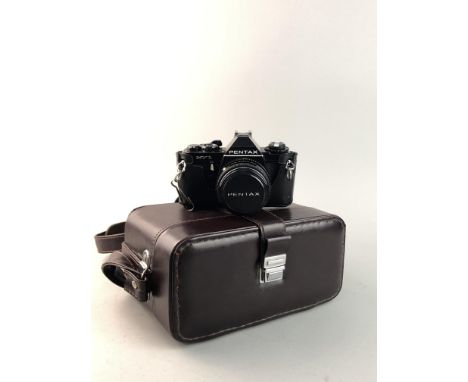 PENTAX MV1 CAMERA, in carry case and box, along with a flash unit and a tripod