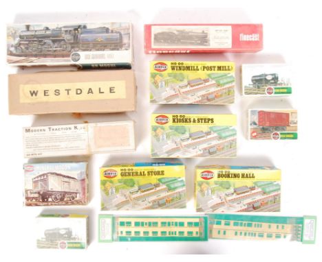 A collection of assorted 00 gauge railway train model kits. Largely plastic kits - Airfix - BR Mogul, Mineral Wagon, Esso Tan
