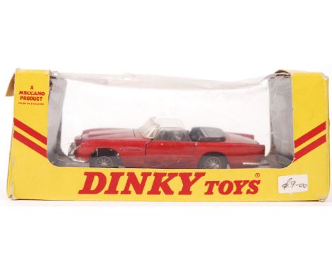 An original vintage Dinky Toys diecast model No. 110 ' Aston Martin DB5 '. Red, with black interior. Within the original expo