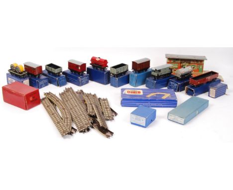 A collection of vintage Hornby Dublo 00 gauge railway trainset rolling stock items and accessories. Comprising of several box