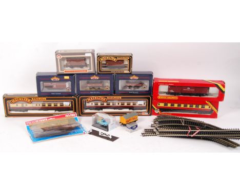 A collection of assorted 00 gauge railway trainset boxed rolling stock items and accessories. To include; 2x boxed Mainline R