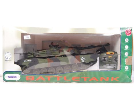 A large scale R/C Radio Controlled The Discovery Store ' Battle Tank '. Appears complete, with remote, tank &amp; power plug.