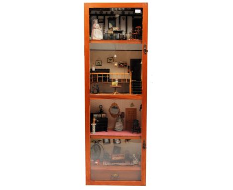 A fabulous vintage cabinet ' dolls house '. Depicting four rooms - Country Living Room, Linen Shop, Living Room and a Nursery