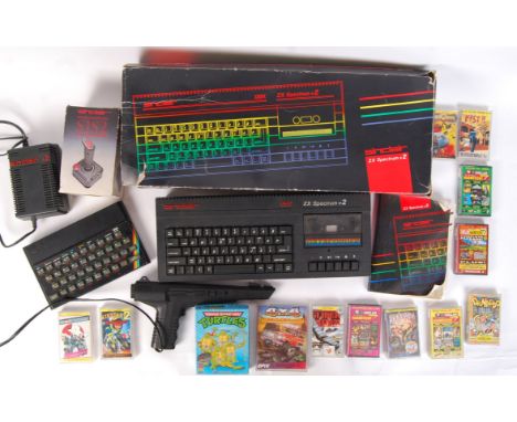 An original vintage Sinclair made ZX Spectrum + 2 games console, within the original box. Along with a ZX Spectrum, Light Gun