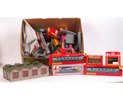 A large collection of assorted 00 gauge railway trainset rolling stock, locomotives and scenic elements. To include; a boxed 