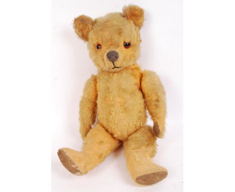 A charming vintage early 20th century possibly Chiltern made children's golden mohair teddy bear. Glass eyes, snout and joint