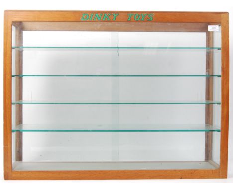 An incredible original vintage c1950's Dinky Toys shop / dealership advertising display cabinet, in light oak. Comprising of 