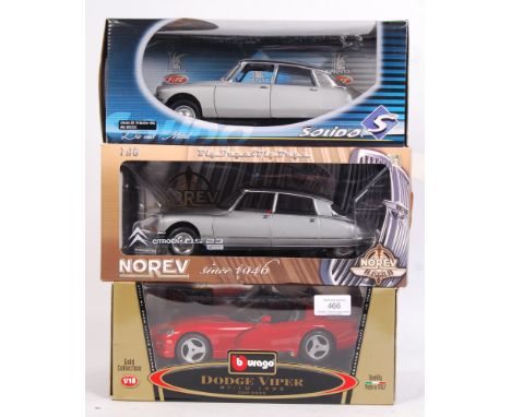 A collection of 3x 1:18 large scale precision diecast model cars. All appear mint, within the original boxes. Comprising; Nor