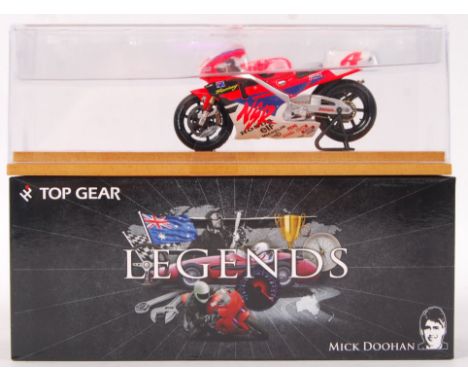 A superbly detailed 1:43 scale precision diecast model by Top Gear. From the ' Legends ' series. TGL02 - Mick Doohan, Honda N