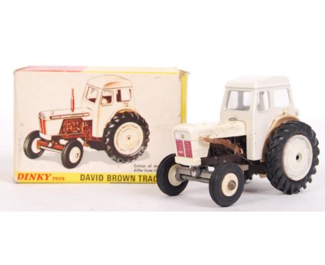 An original vintage Dinky Toys made No. 305 ' David Brown Tractor '. 'Removable Cab, Steering Wheel Operating Front Axle, Lif