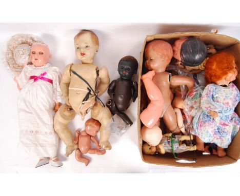 A good large collection of assorted vintage dolls, doll parts, clothing and related items. To include; an antique German Hand