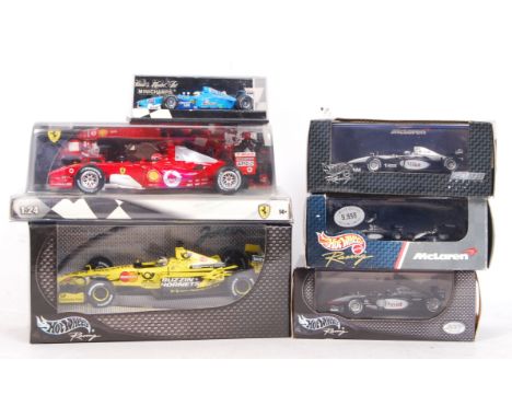 A good collection of 6x boxed Formula One precision diecast model cars. Largely Hot Wheels Racing , but one Paul's Model Art 