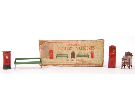 A charming vintage Hornby Meccano 0 gauge boxed set of ' Platform Accessories For Toy Railways .' Comprising of 1x bench, Pil