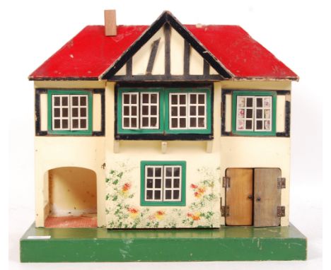 A rare vintage Triang Lines Brothers made c1950's dolls house No.61 . Featuring metal framed windows, semi-timbered gables, c