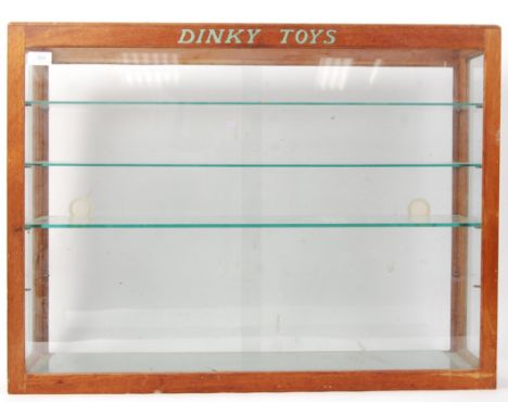 An incredible original vintage c1950's Dinky Toys shop / dealership advertising display cabinet in light oak. Comprising of f