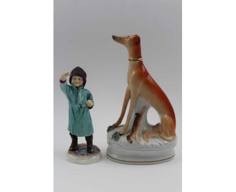 A Royal Worcester bone china figurine, February 3453, 16cm high, together with a 19th century Staffordshire seated long dog, 