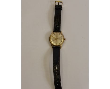 A Gentleman's Vintage Garrard Automatic 9 ct Gold Hallmarked Wrist Watch case No. 13377 mm DS & S, the watch having baton num