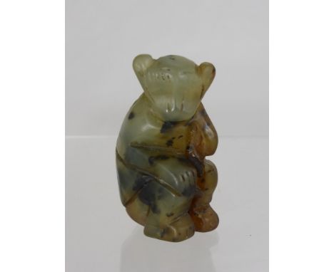 A Carved Hard Stone Figure of a Monkey, possibly jade approx ht 7 cms. 