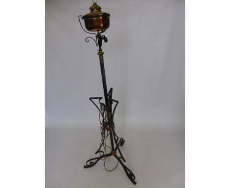 A Copper and Wrought Iron Lamp Stand, converted from an oil lamp with a lamp shade.