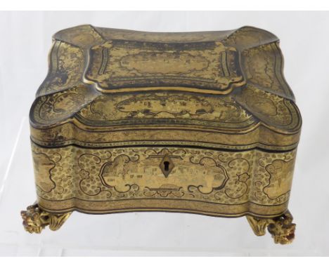 An Oriental Lacquer Tea Caddy, decorated with scenes of courtiers taking tea, supported on dragon mask feet. 