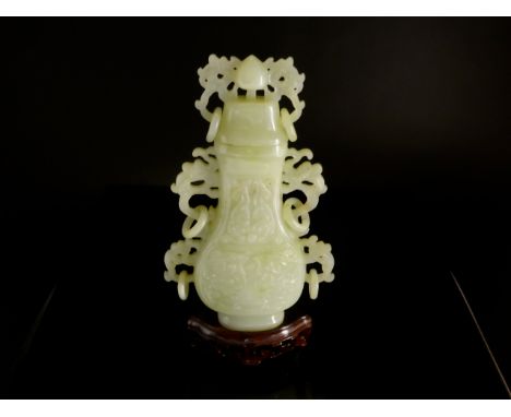 Chinese 20th Century Pale Celadon Jade Vase and Cover, the flattened pear shaped vase decorated in shallow relief with dragon