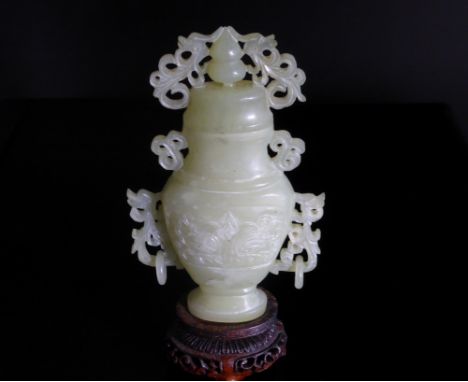 Chinese 20th Century Pale Celadon Jade Vase and Cover, the vase with white inclusions and featuring Taotie carved in shallow 