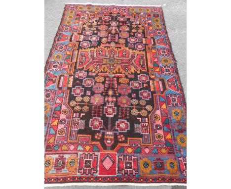 An Antique Turkish Style Woollen Carpet, geometric design in red/ochre/pink and blue, approx 150 x 250 cms.