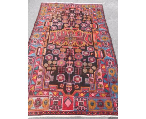 An Antique Turkish Style Woollen Carpet, geometric design in red/ochre/pink and blue, approx 150 x 250 cms.