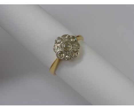 A Lady's 18ct Gold and Platinum Diamond Ring, the ring set with nine old cut diamonds, size O, approx 4.2 gms