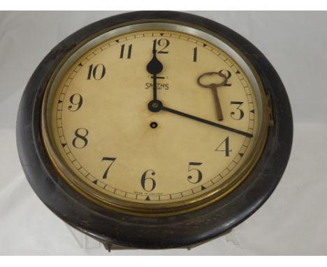 An 8-day Oak Cased Smith Wall Clock, enamel face and dial approx 40x 40 cms. 