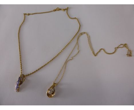 A Lady's 10 K Gold, White Stone Pendant and chain together with 925 pendant and chain. (2)